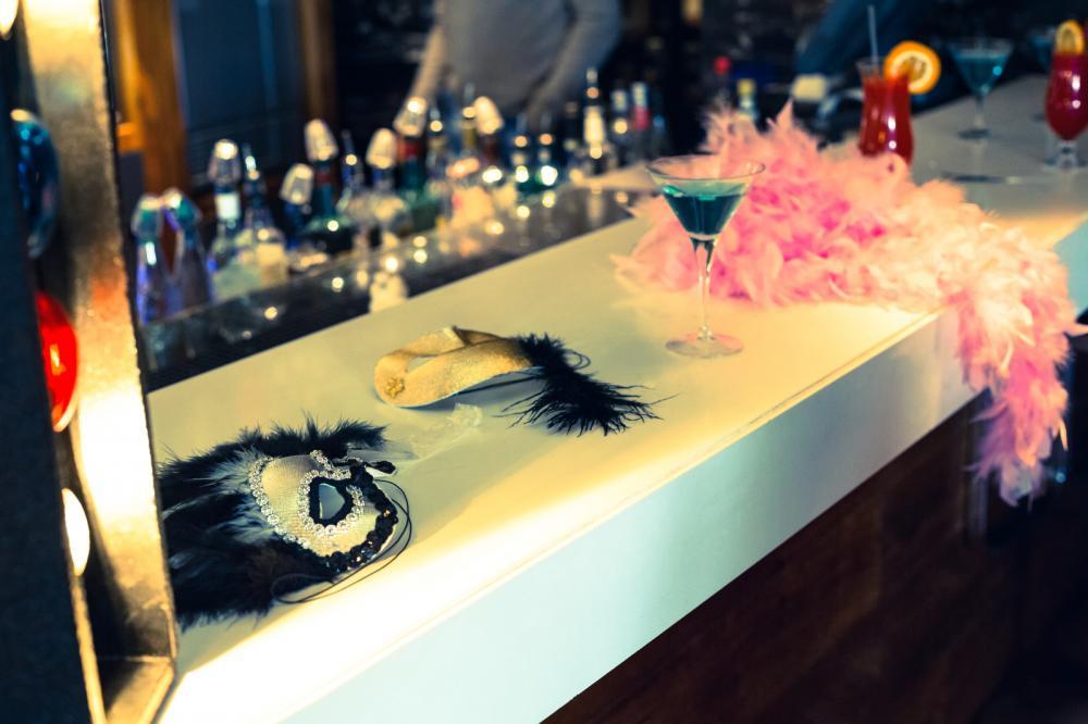 Masquerade masks and cocktails at the bar