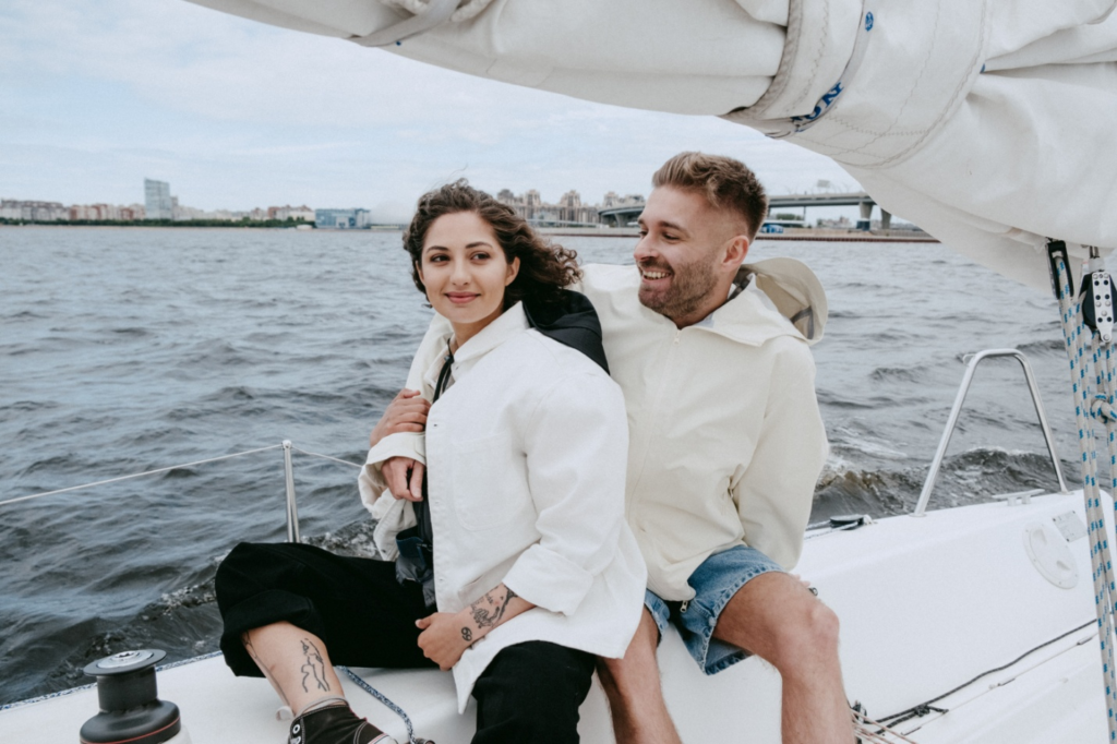 A couple sitting on a luxury yacht
